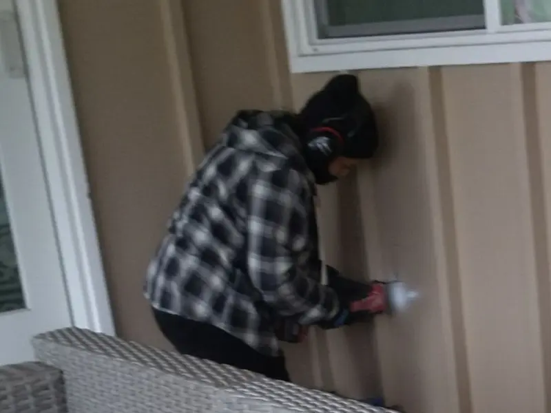 Professional electrician installing an exterior outlet in Wells Branch